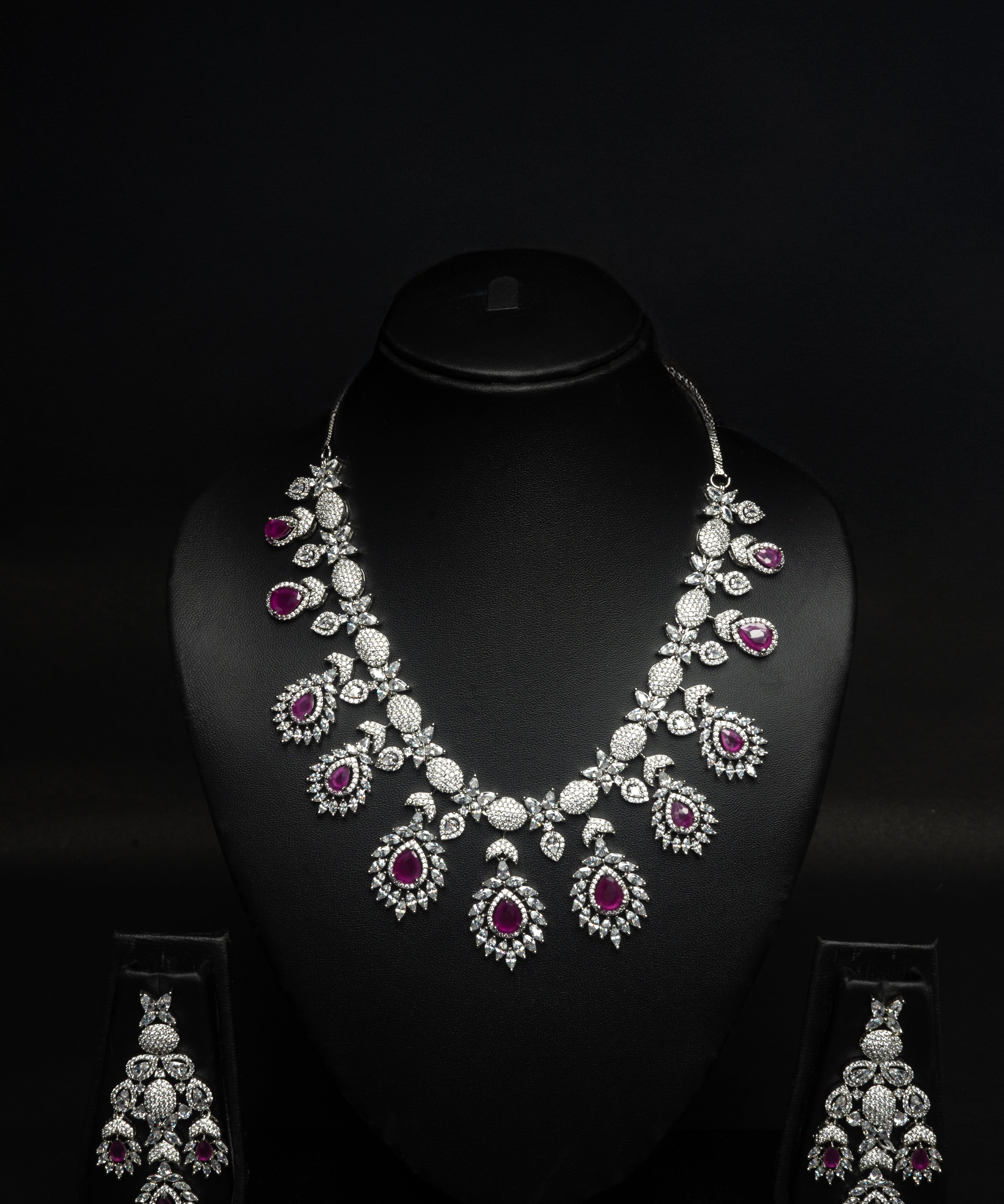 ruby Jewelry set with necklace and earrings on a black background